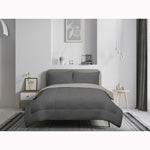 Camden Charcoal reversible comforter set, 3 piece, double/queen, on a made bed
