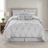 Chateau 7-piece queen pinch pleat comforter set in grey in a bright bedroom, front view