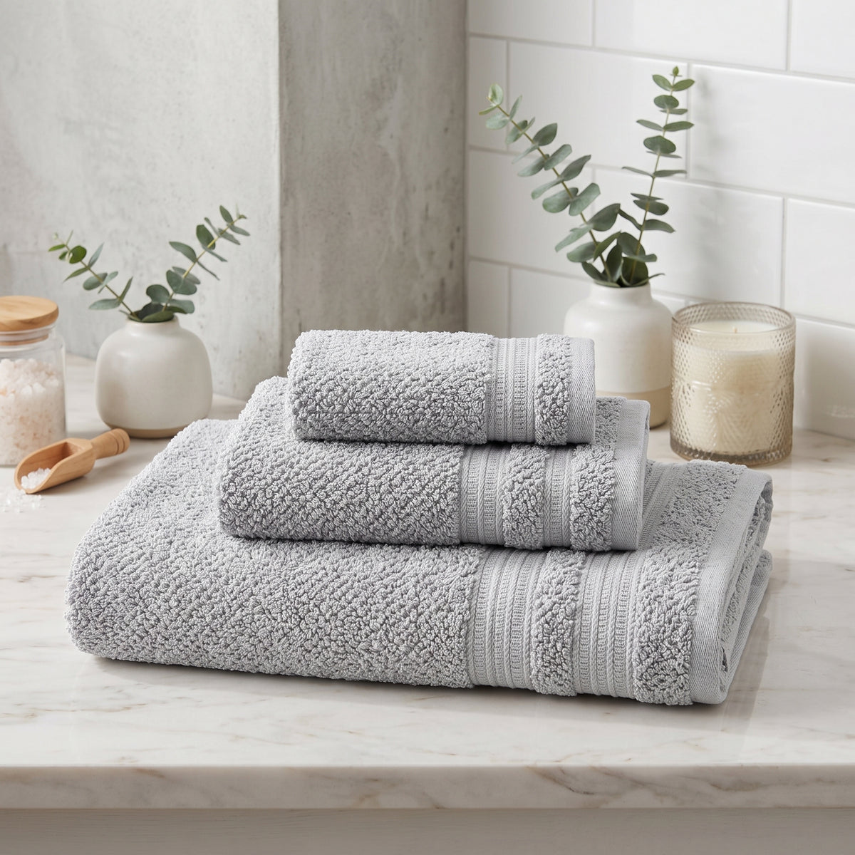 Light Grey textured cotton bath towels in a bathroom setting
