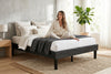 Queen platform bed frame in black wood-grain finish, bedroom styling view 3
