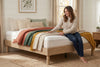 King platform bed frame in natural oak-look finish, bedroom styling view 3
