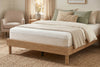 King platform bed frame in natural oak-look finish, low profile with round legs