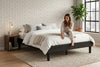 King platform bed frame in black wood-grain finish, bedroom styling view 3